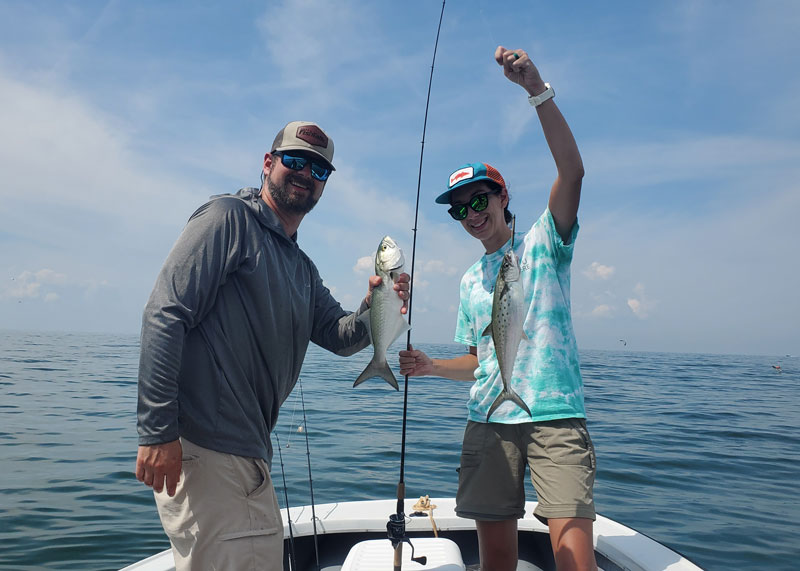 anglers with mackerel and bluefish
